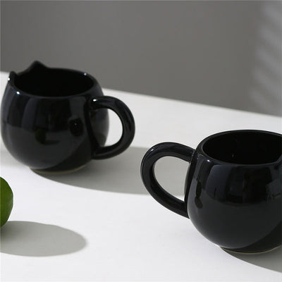 Adorable hand - painted cat - shaped ceramic mug, perfect for coffee or tea. - Korvel