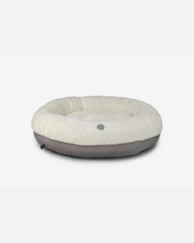 Cama para perros en forma de dona de felpa acogedora en beige suave