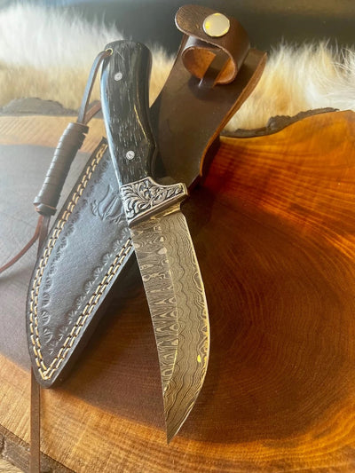 Artisan Crafted Damascus Steel Hunting Knife with Sheep Horn Grip and Engraved Guard - Korvel