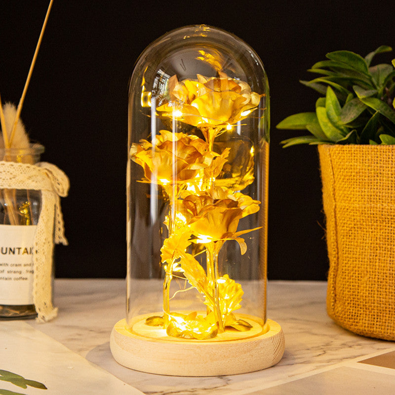 Adorno de rosas de oro con cubierta de vidrio y luz LED
