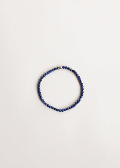 Pulsera de cuentas elástica de lapislázuli y oro de 14 quilates