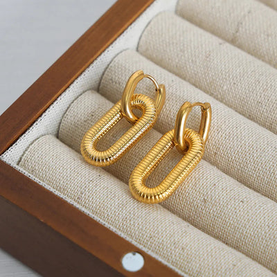 Boucles d'oreilles pendantes en acier titane élégant