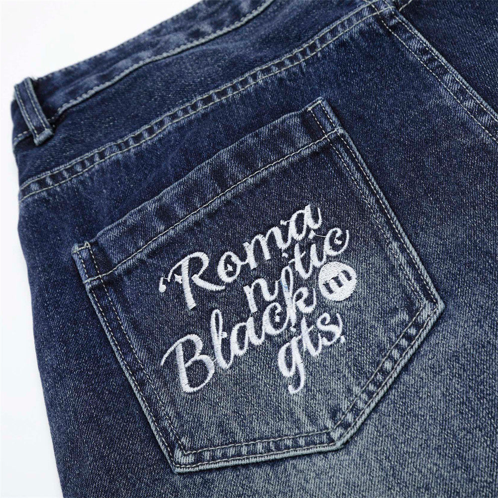 Pantalones de mezclilla de pierna ancha bordados con flores para hombres