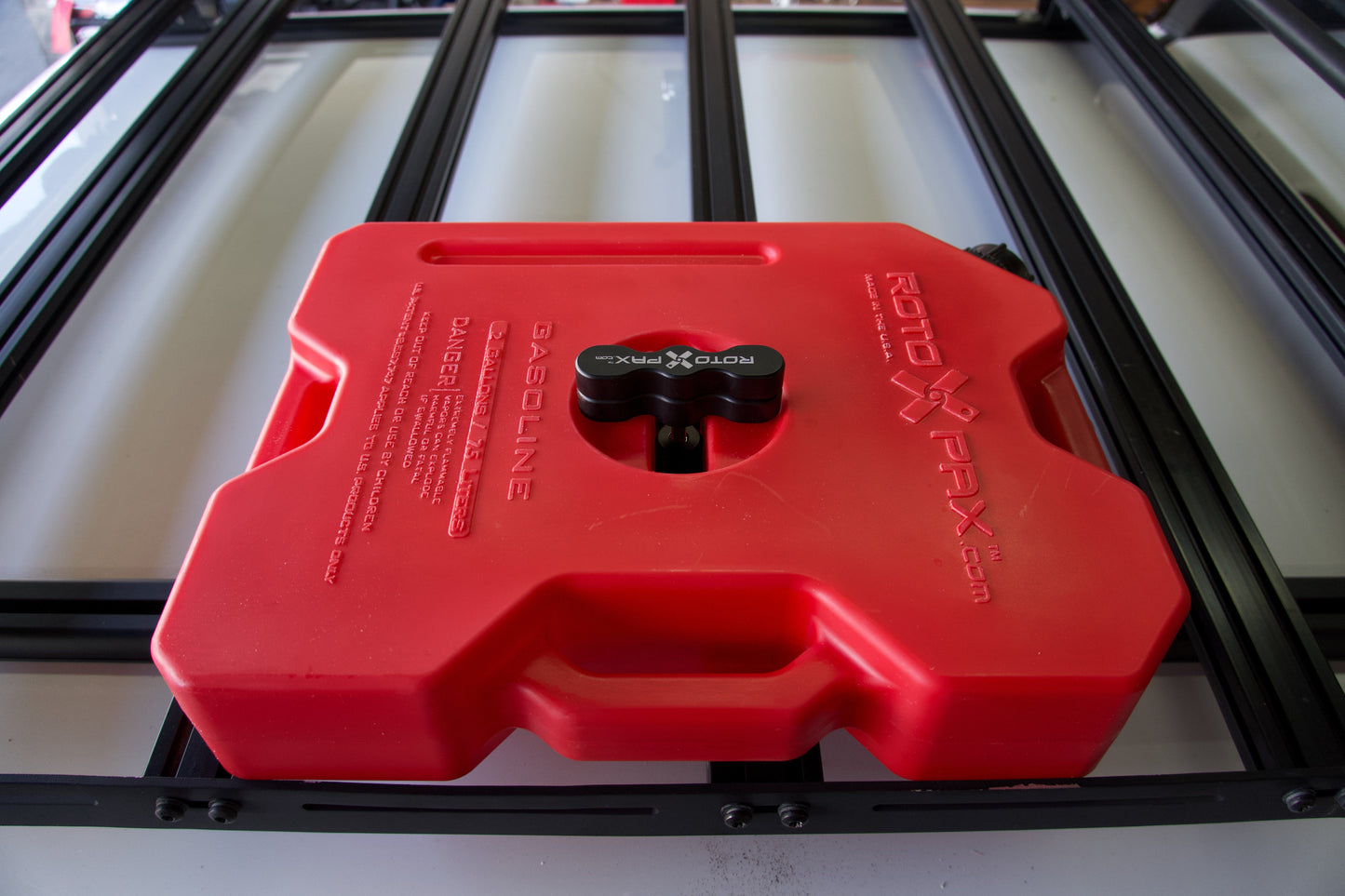 Billet aluminum Rotopax mount adapter for extrusion roof rack cross bars. - Korvel