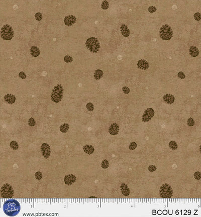 Tissu en coton Bigfoot Country avec des pommes de pin brunes - 44"/45" par yard