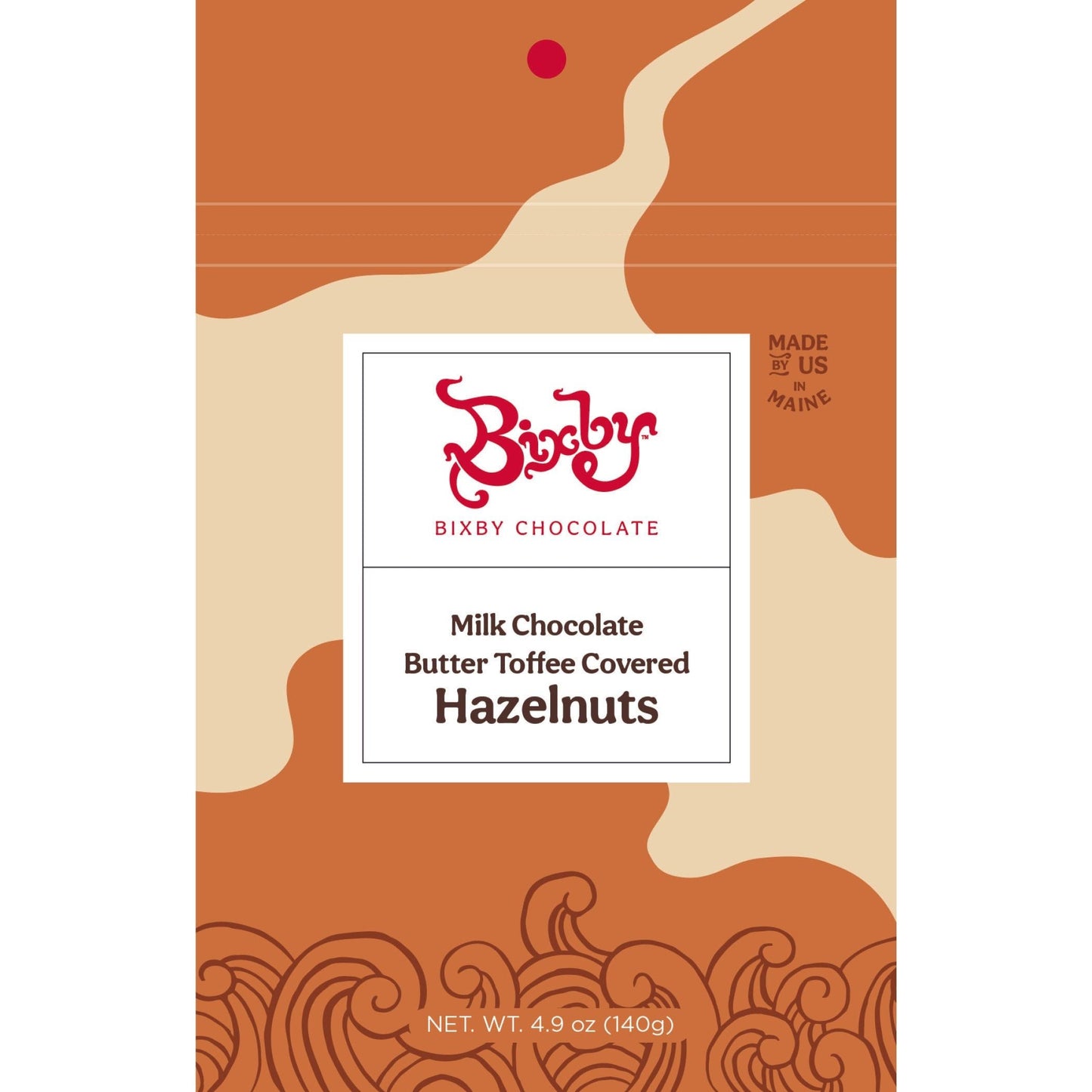 Avellanas cubiertas de chocolate con leche y caramelo de mantequilla