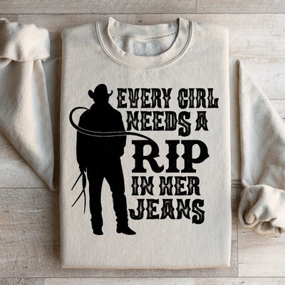Cada chica necesita un desgarrón en sus jeans sudadera