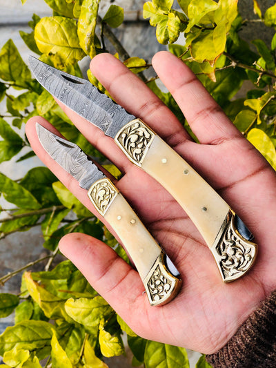 Exquisite Pair of Custom Handmade Damascus Steel Folding Pocket Knives with Bone Handles and Engraved Brass Bolsters - Korvel