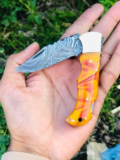 Exquisite Custom Damascus Steel Folding Pocket Knife with Unique Epoxy Resin Handle & Leather Sheath - Korvel