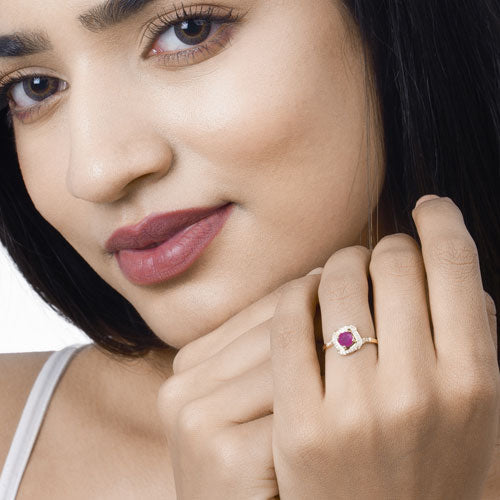 0.63 Carat Ruby and Diamond Halo Ring in 14K Yellow Gold