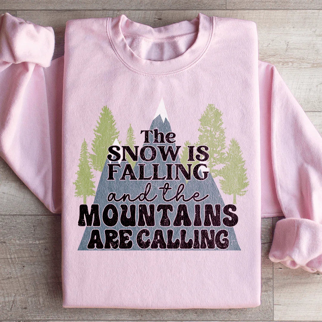 La nieve está cayendo y las montañas están llamando Sudadera