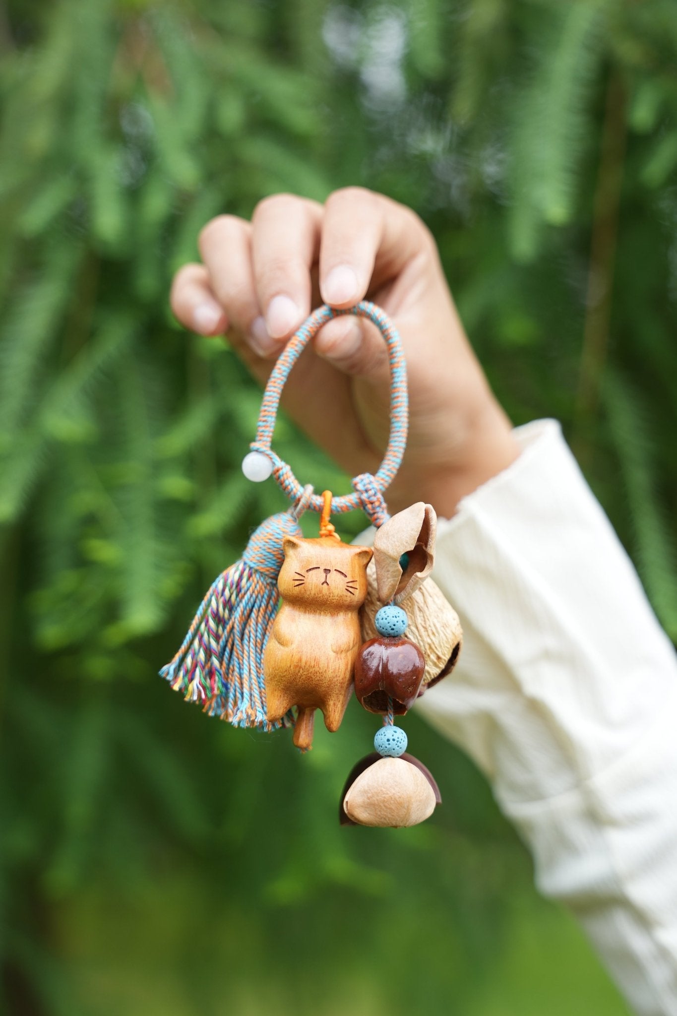 The Naptime Kitty - Hand-Carved Wooden Cat Charm with Natural Seeds & Tassel