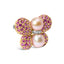 Broche de mariposa de perla del mar del sur y zafiro rosa de 18 quilates
