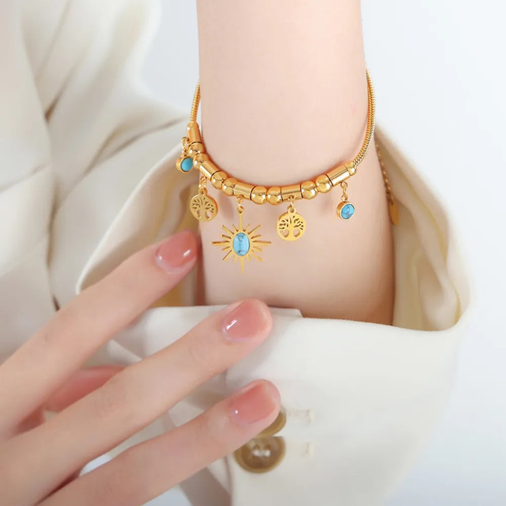 Pulsera de encanto de acero de titanio chapado en oro