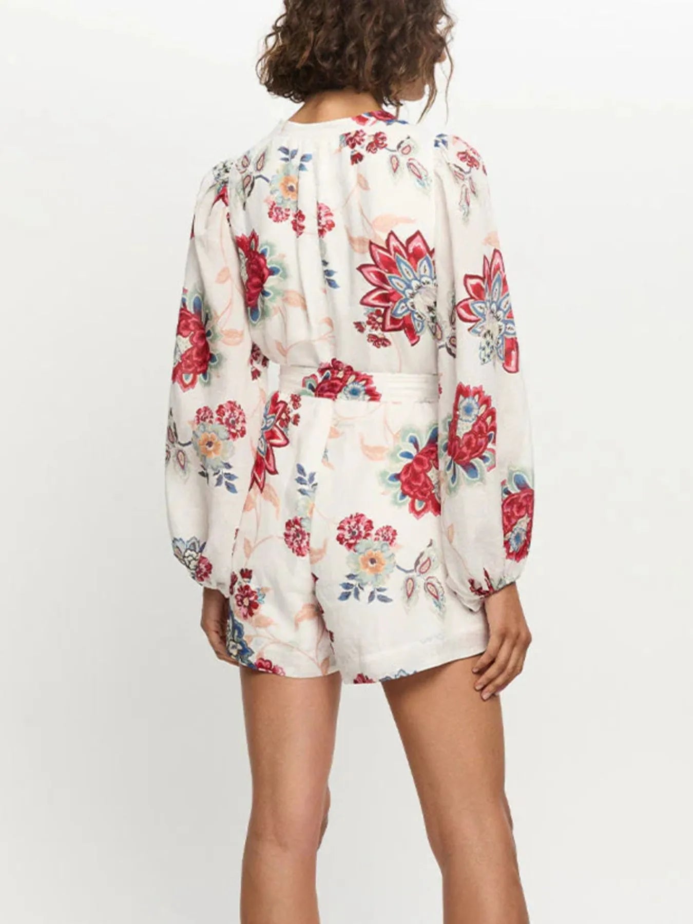 Mono de manga larga con estampado floral