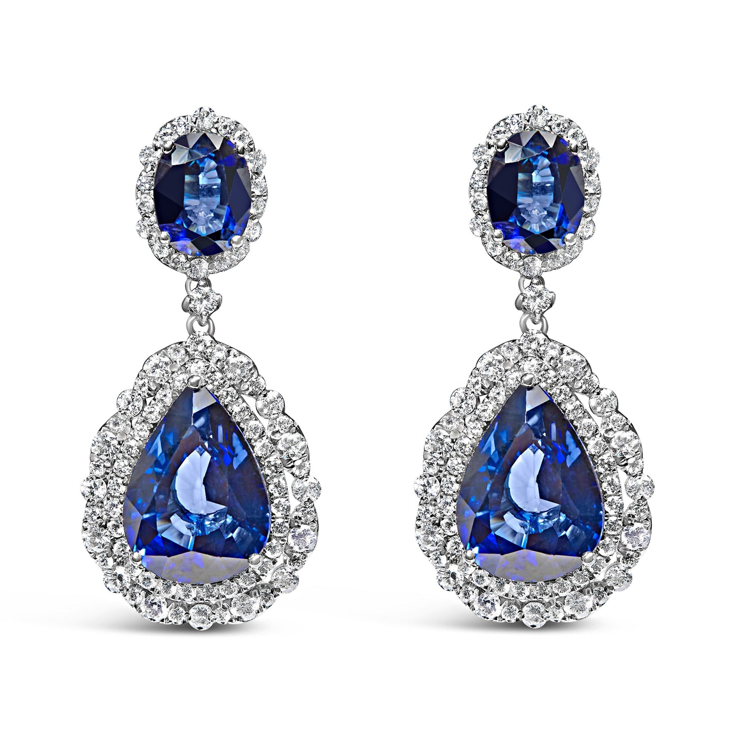 Boucles d'oreilles pendantes en or blanc 18K avec saphirs bleus et halo de diamants