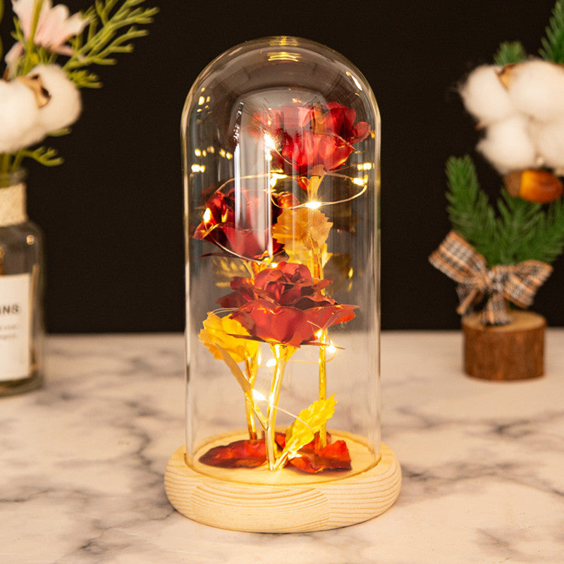 Ornement en verre avec roses en feuille d'or et lumière LED