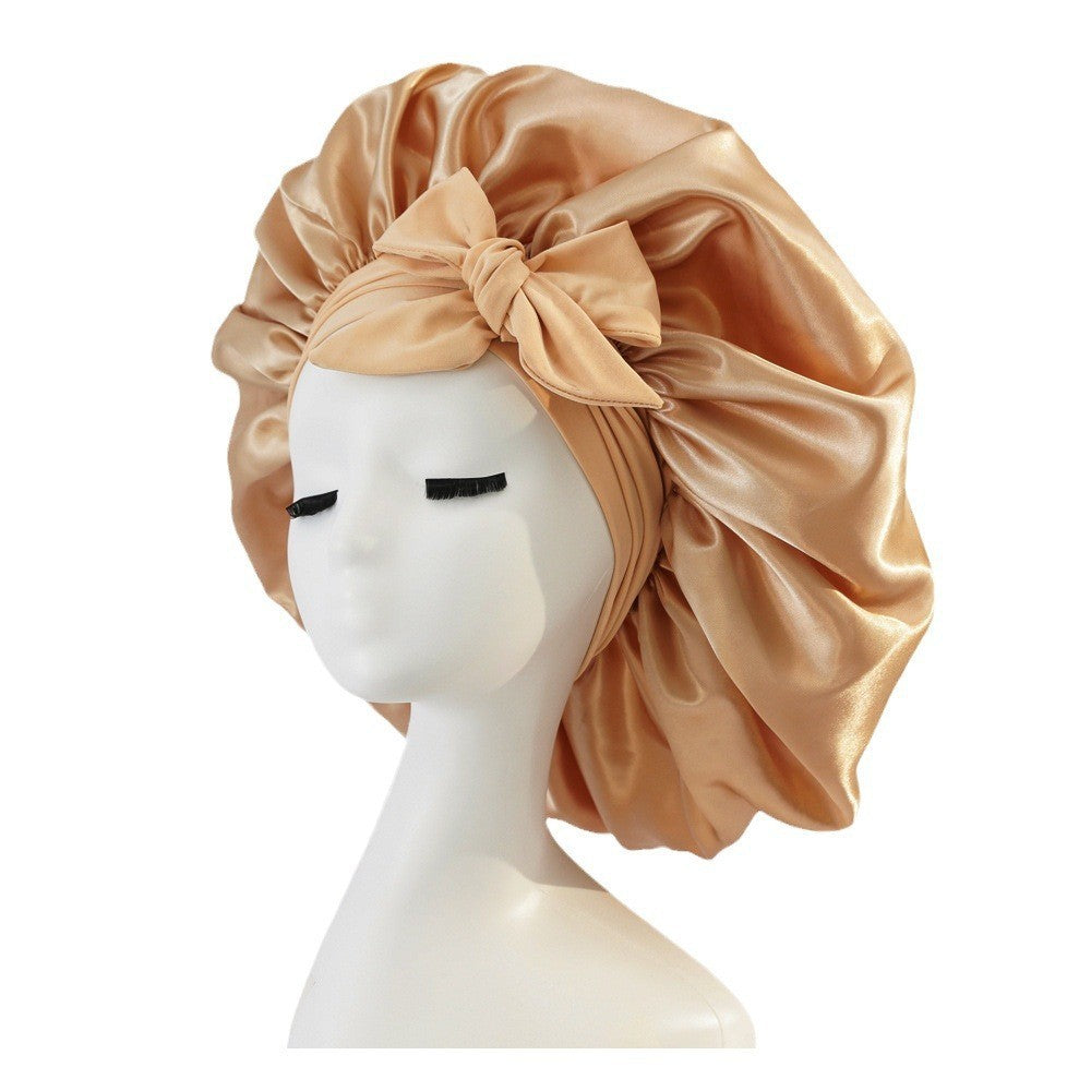 Turban élégant à large bord avec détail en nœud
