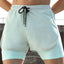 Shorts actifs pour hommes avec cordon de serrage et doublure de compression