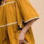 Vestido de media manga con cuello atado y dobladillo de contraste con borlas