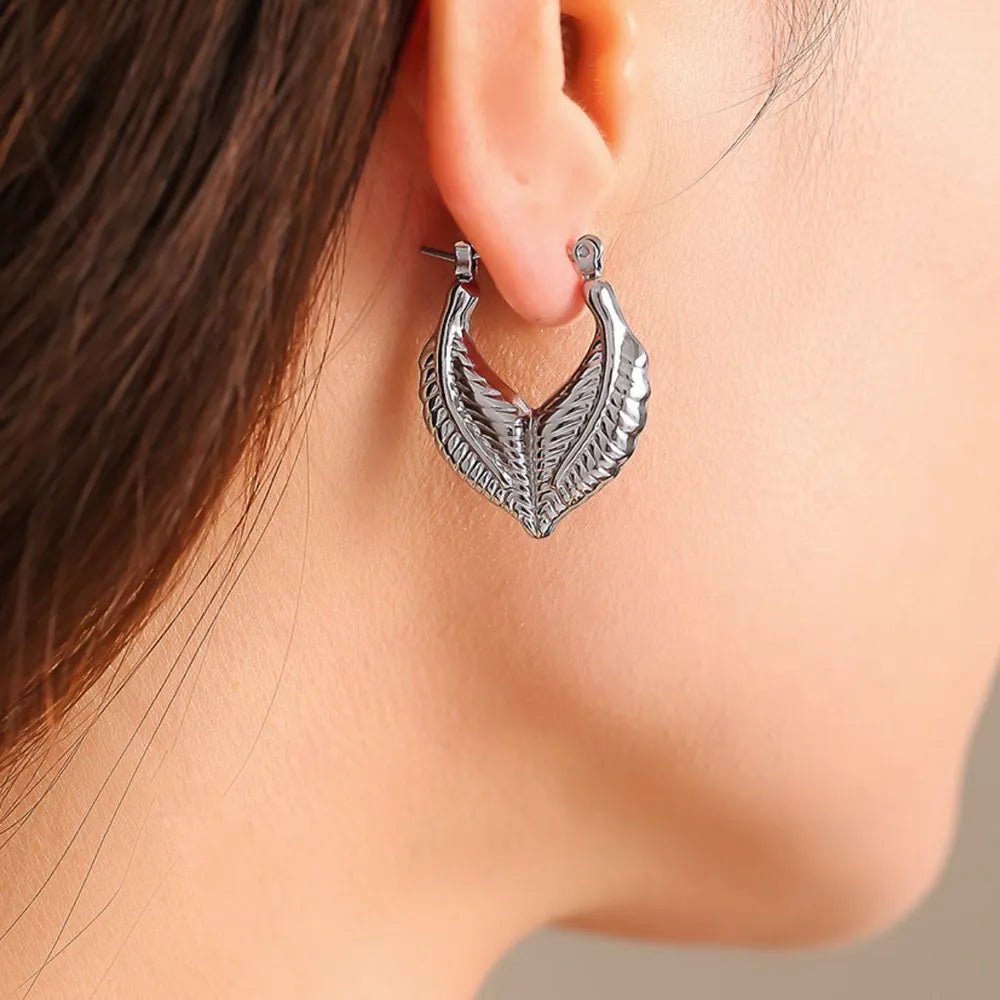 Leaf patchwork heart-shaped earrings with a niche design and titanium steel earrings - Korvel