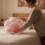 Coussin en forme de patte de chat rose charmant