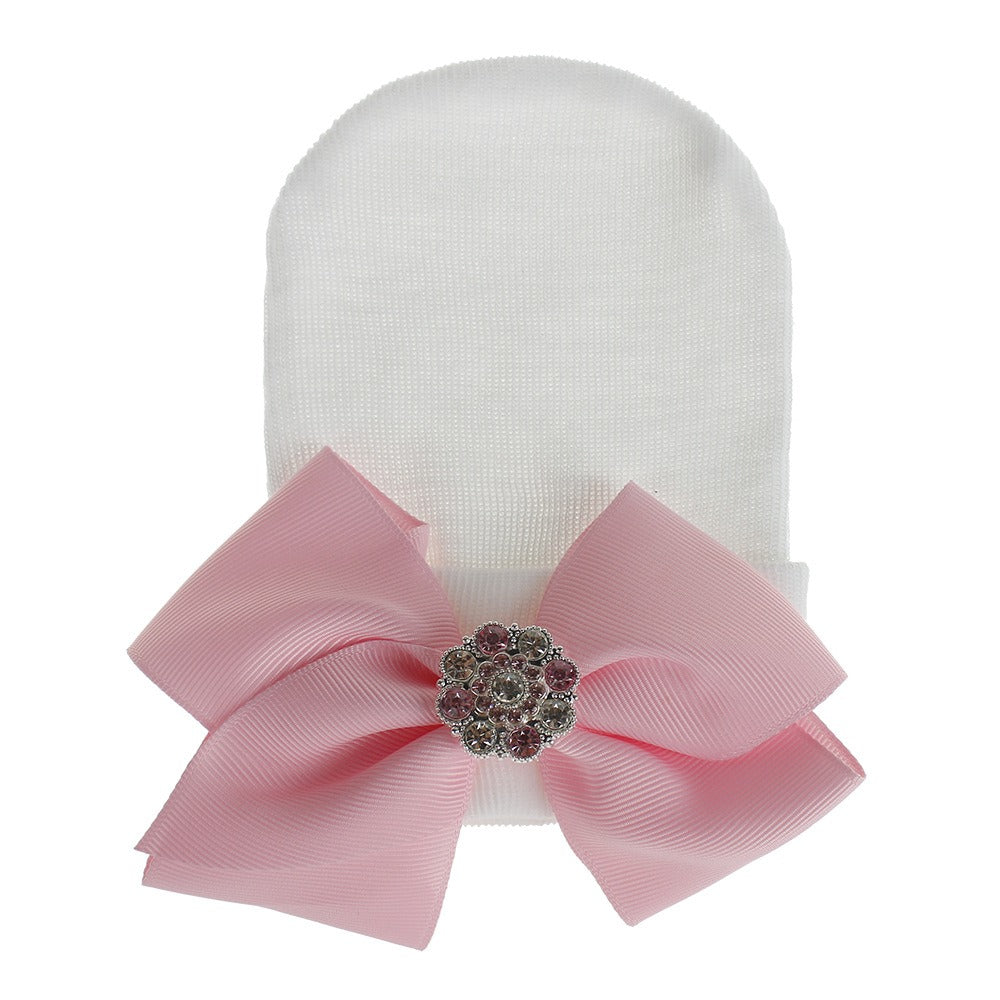 Chapeau en tricot rayé rose scintillant pour bébé avec un grand nœud