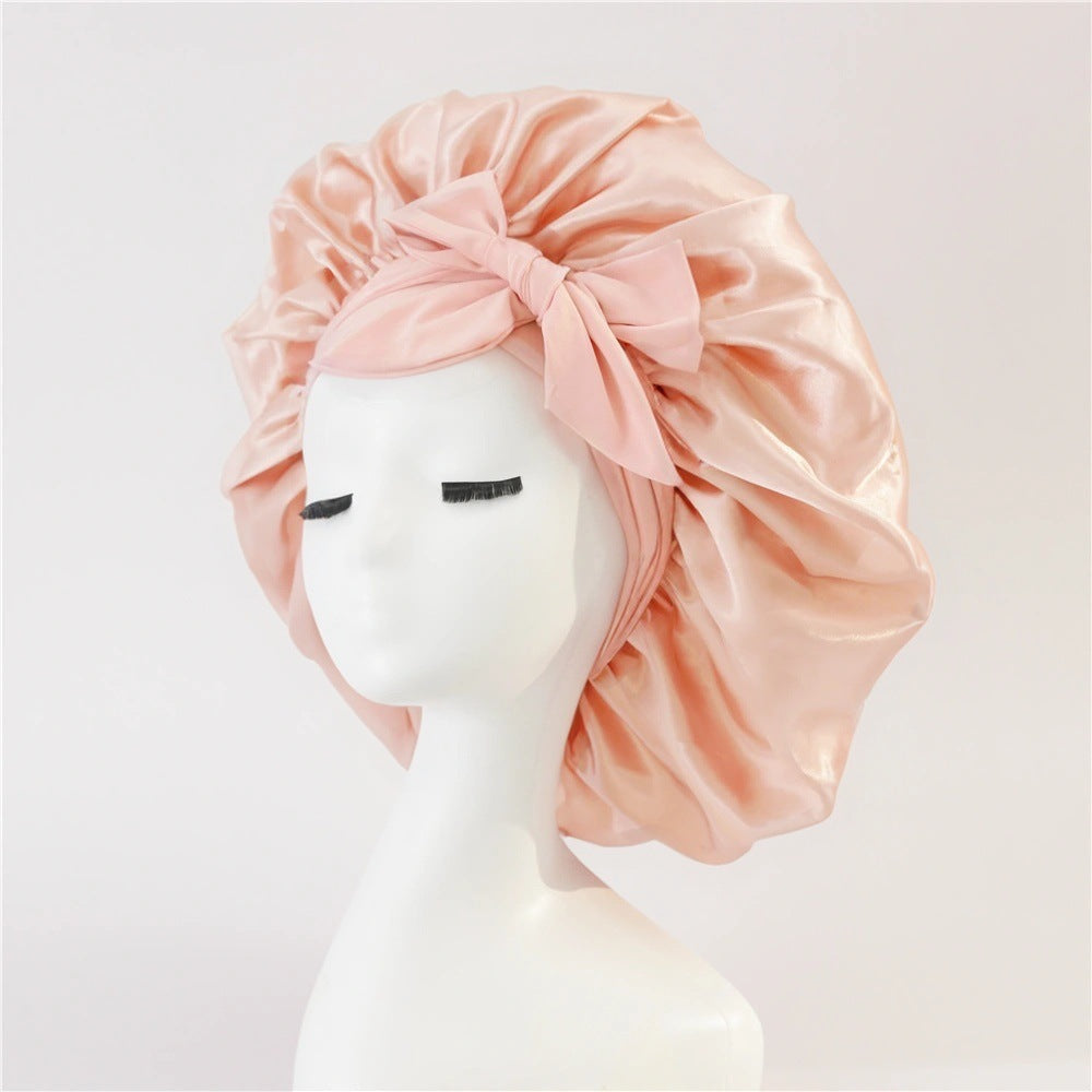 Turban élégant à large bord avec détail en nœud