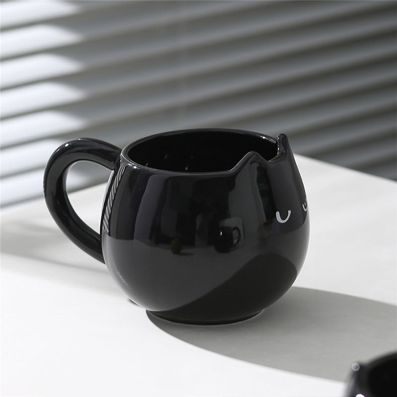Adorable hand - painted cat - shaped ceramic mug, perfect for coffee or tea. - Korvel