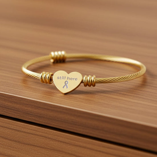 Still Here – Pulsera Cuff Corazón Trenzado