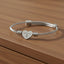 Still Here – Pulsera Cuff Corazón Trenzado