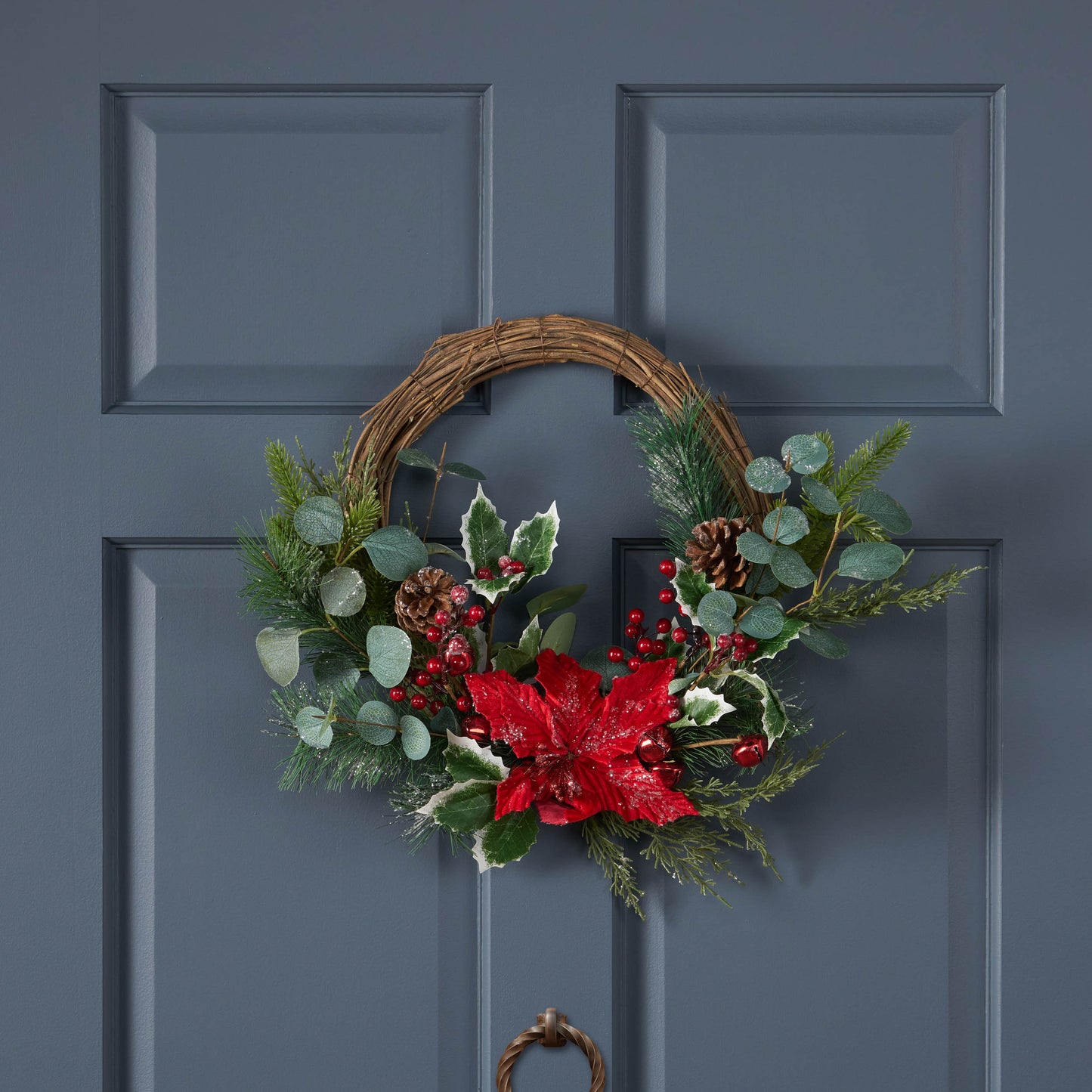23.5" POINSETTIA/BERRY/EUCALYPTUS HALF WREATH - Korvel