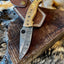 Artisan Crafted Damascus Steel Pocket Knife with Engraved Brass Handle - Korvel