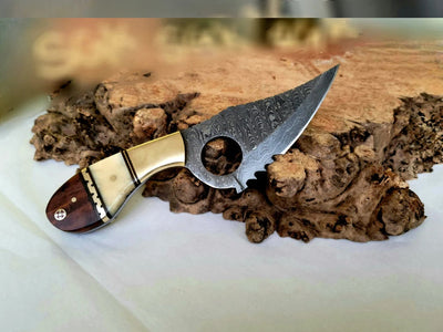 Artisan Damascus Steel Skinning Knife with Ergonomic Finger Hole and Elegant Handle - Korvel