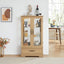Light colored glass cabinet with adjustable glass frame, including cabinet light bulbs OAK with 2 doors and 1 drawer - Korvel