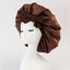 Turban élégant à large bord avec détail en nœud
