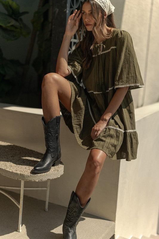 Chic Bohemian Tiered Dress with Tassel Details and Contrast Trim - Korvel