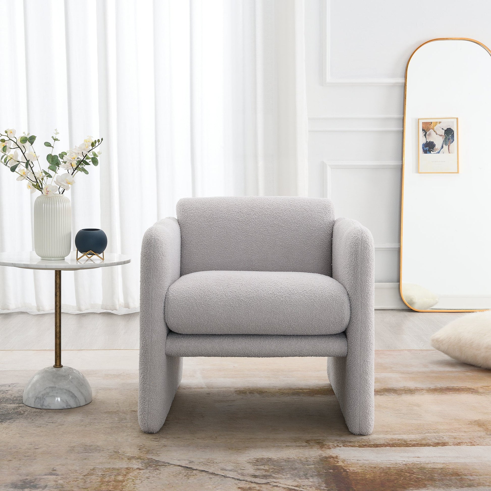 Armchair with wavy armrests, metal decorations on both sides of the armrests, made of Teddy cloth, light gray - Korvel