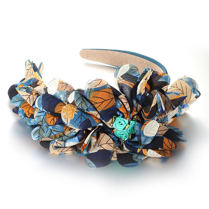 Bandeau à motif floral et feuillage surdimensionné