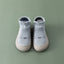 Chaussures de sol souples pour bébés avec chaussettes pour les premiers pas