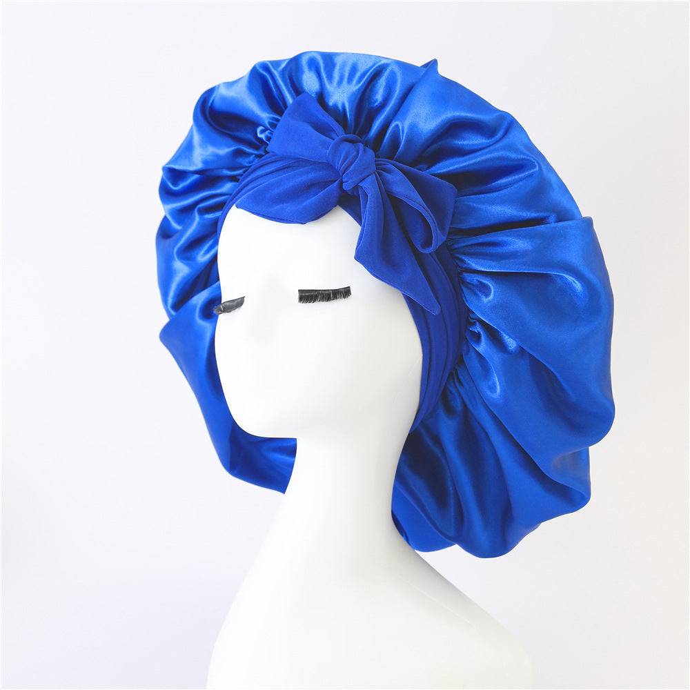 Turban élégant à large bord avec détail en nœud