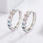 Pendientes Huggie de Corazón Incrustados de Zirconita en Plata de Ley 925