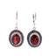 Pendientes colgantes de granate y diamante de 0.38 ct en plata esterlina