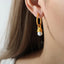 Boucles d'oreilles Huggie en acier titane premium
