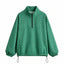 Chaqueta con capucha de media cremallera y lunares a la moda
