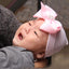 Chapeau en tricot rayé rose scintillant pour bébé avec un grand nœud