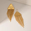 Triangular relief devil's eye design with tassel titanium steel earrings - Korvel
