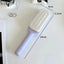 Brosse à cheveux rotative auto-nettoyante avec caractéristiques anti-statiques