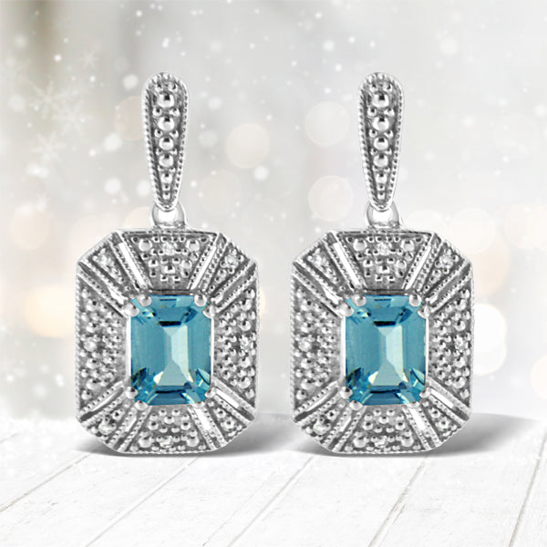 Boucles d'oreilles en argent sterling .925 avec topaze bleue en forme d'émeraude et accents de diama