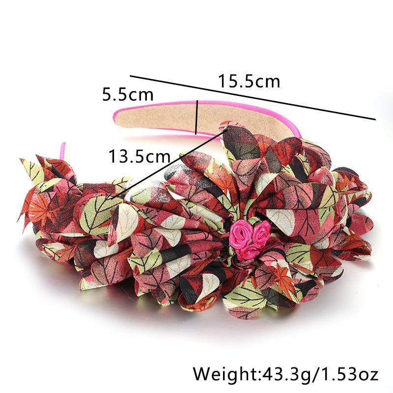 Bandeau à motif floral et feuillage surdimensionné